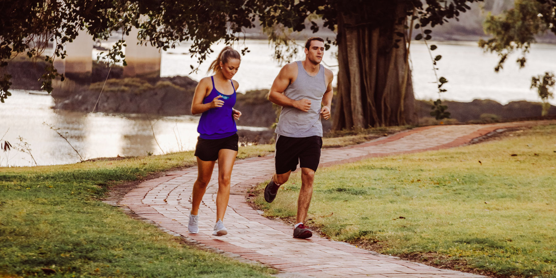 Couple running in Rockhampton Col Brown riverside park