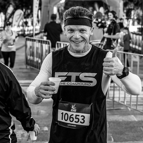 Man drinking at hydration station at Rocky River Run